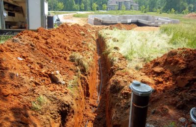 Trenching And Laying Pipe And Wire From A Water Well To A New Home