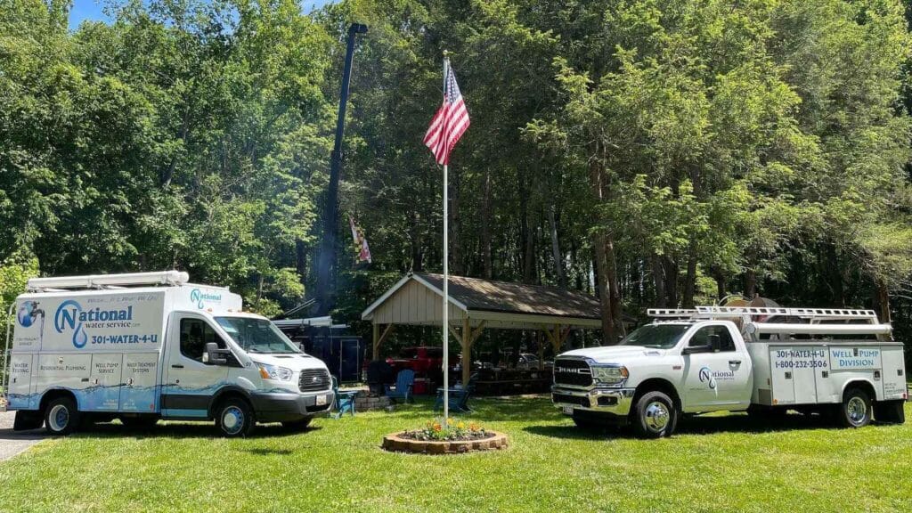 A Group Of Vehicles Parked In A Grassy Area
