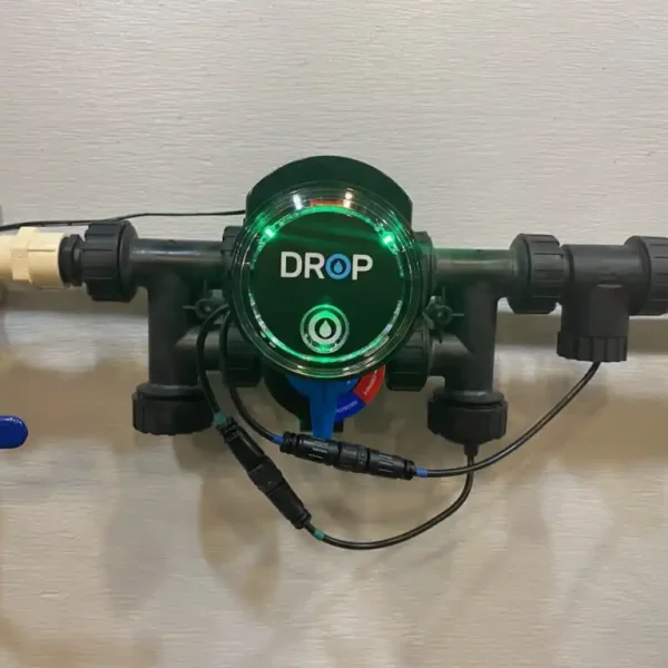 A Water Sprinkler With A Green Light